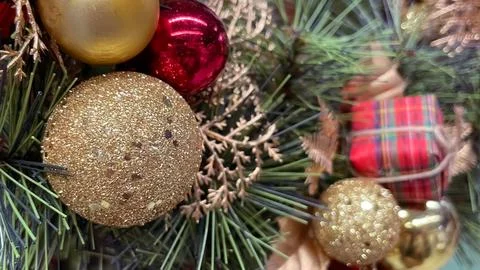 Frosted pine cones, red gingham bow, and berries creating a rustic Christma.. Stock Photos