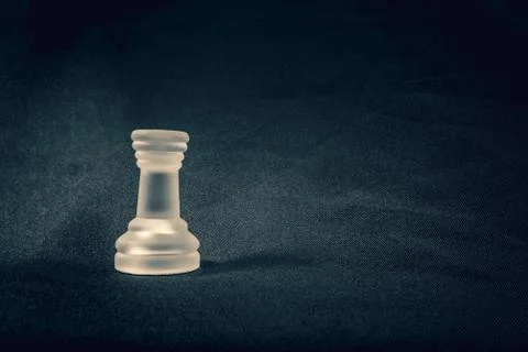 Frosted Rook chess piece on dramatic background Stock Photos