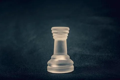 Frosted Rook chess piece on dramatic background Stock Photos