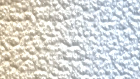Frosted rough surface with white and blue highlights. 4K Video stock 343244372