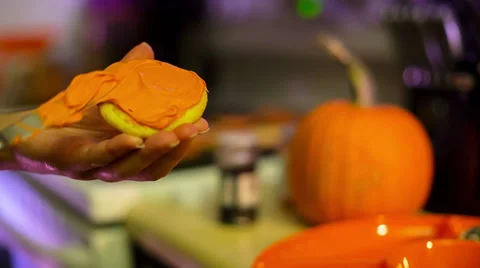 Frosting a Cookie Halloween Stock Footage 57751777