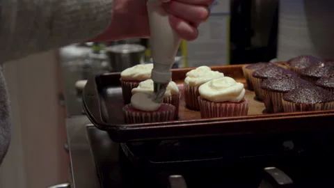 Frosting Cupcake on Stove Stock Footage 142155939