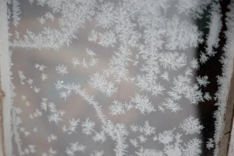 Frosty abstract patterns on the window Stock Photos