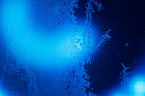 Frosty lightened window. Stock Photos