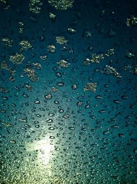 Frosty natural pattern on winter window, drops and sun Stock Photos