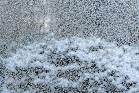 Frosty ornament pattern. Car Window frozen in frost on a winter morning. Tran Stock Photos