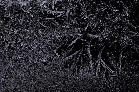 Frosty pattern on black background Stock Photos