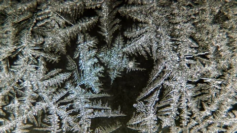 Frosty pattern on glass melts Stock Footage 72587593