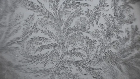 Frosty pattern on glass melts Stock Footage 72768081