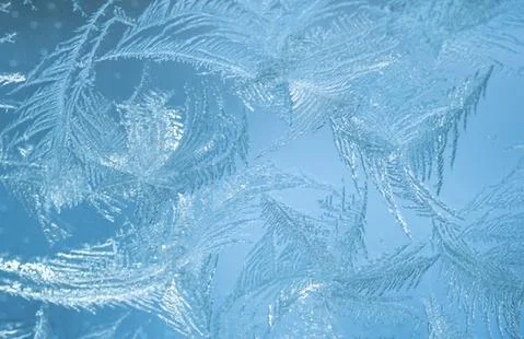 Frosty pattern on glass Stock Photos