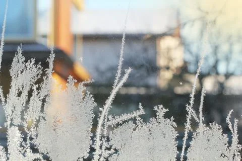 Frosty pattern on glass winter window Stock Photos