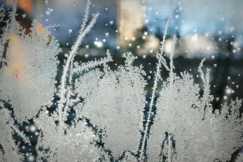 Frosty pattern on glass winter window Stock Photos