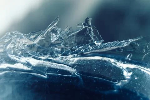 Frosty pattern in nature. Texture of ice and water. Stock Photos