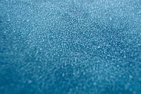 Frosty pattern in nature. Texture of ice and water. Stock Photos