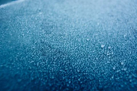 Frosty pattern in nature. Texture of ice and water. Stock Photos
