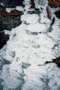 Frosty pattern on a wall of a mountain hut. Frozen snow covered land. Stock Photos