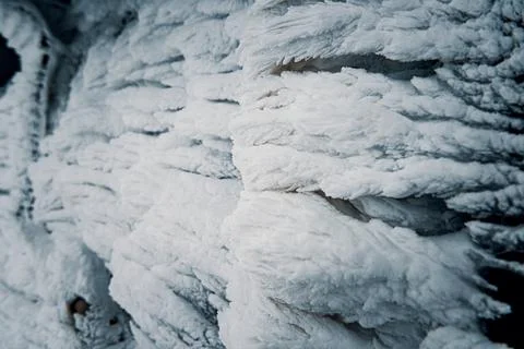 Frosty pattern on a wall of a mountain hut. Frozen snow covered land. Stock Photos
