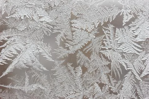 Frosty pattern on the window close-up. Winter background, texture 写真素材