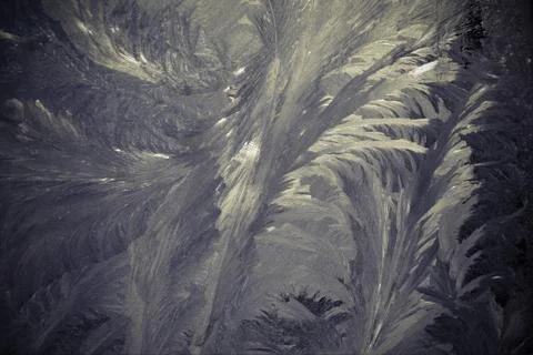 Frosty pattern on the window draws winter grey color Stock-Fotos