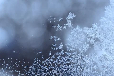 Frosty pattern on the window pane. Stock Photos