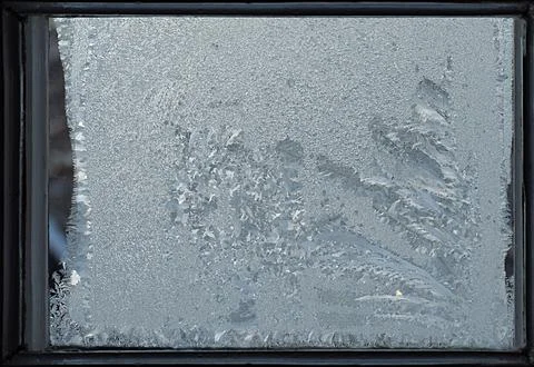 Frosty pattern on the window pane. Foto stock