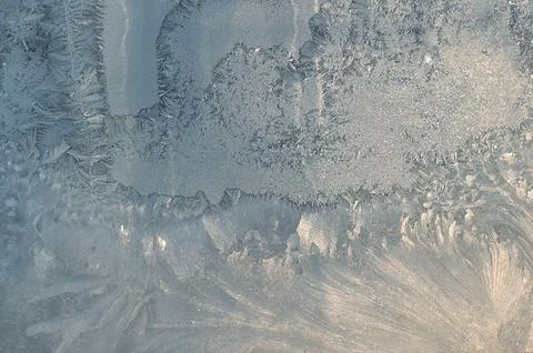 Frosty pattern on the window pane. Stock Photos