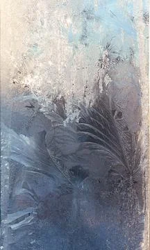 Frosty pattern on the window pane. Stock Photos