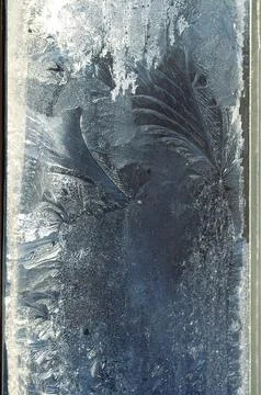 Frosty pattern on the window pane. Stock Photos