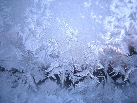 Frosty pattern on winter window Stock Photos