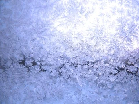 Frosty pattern on winter window Stock Photos