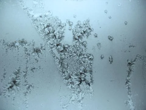 Frosty pattern on winter window Stock Photos