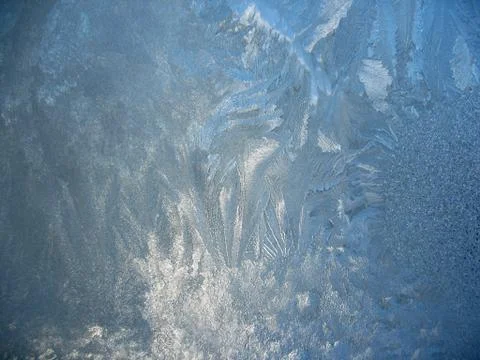 Frosty pattern on winter window Stock Photos
