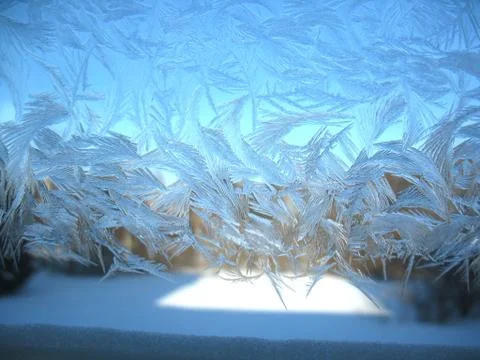 Frosty pattern on winter window Stock Photos