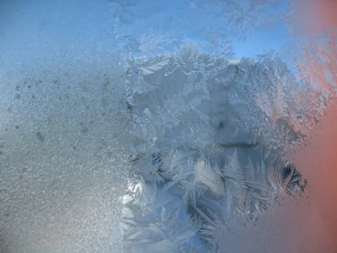 Frosty pattern on winter window Stock Photos