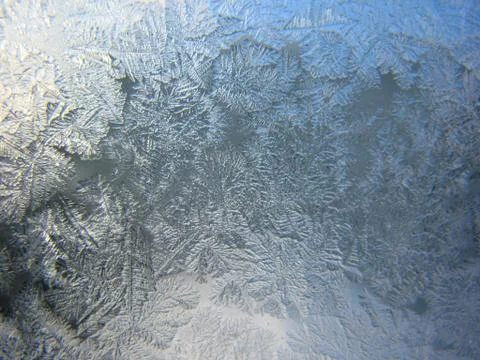 Frosty pattern on winter window Stock Photos