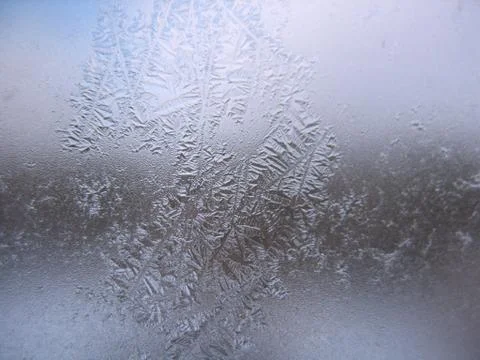 Frosty pattern on winter window Stock Photos