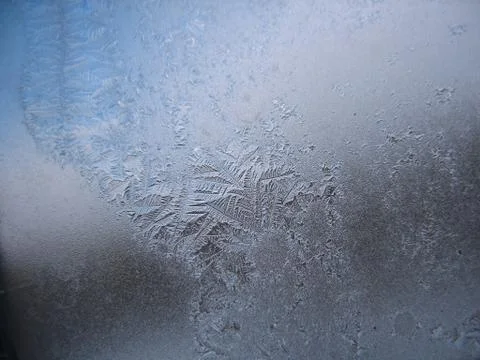Frosty pattern on winter window Stock Photos