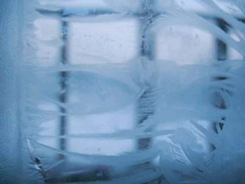 Frosty pattern on winter window Stock Photos