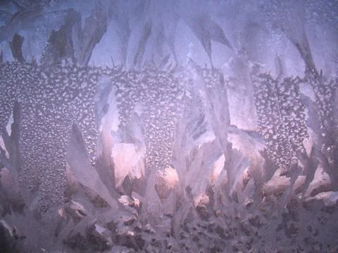 Frosty pattern on winter window Stock Photos