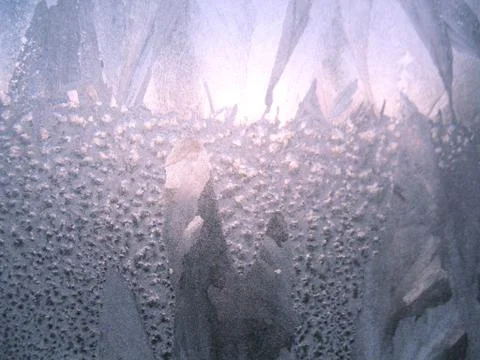 Frosty pattern on winter window Stock Photos