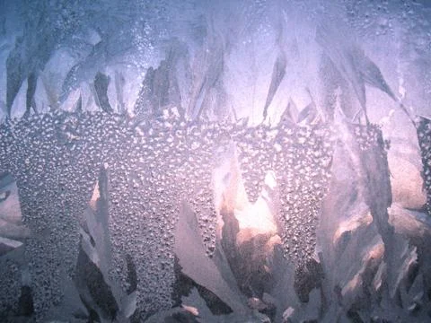 Frosty pattern on winter window Stock Photos