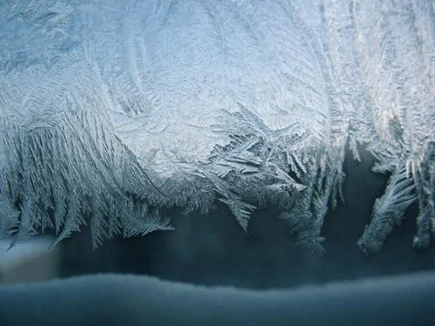 Frosty pattern on winter window Stock Photos