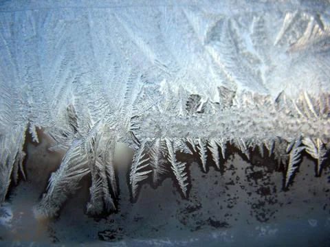 Frosty pattern on winter window Stock Photos