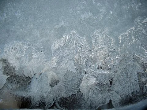 Frosty pattern on winter window Stock Photos