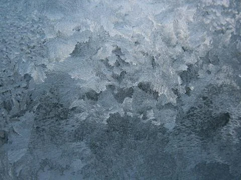 Frosty pattern on winter window Stock Photos