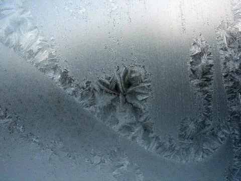 Frosty pattern on winter window Stock Photos