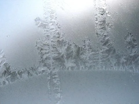 Frosty pattern on winter window Stock Photos