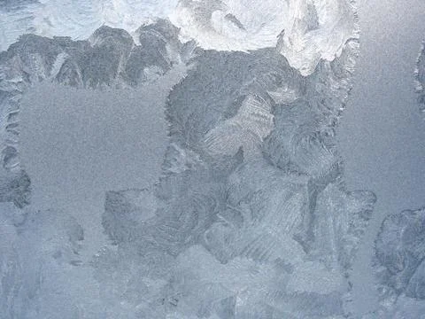 Frosty pattern on winter window Stock Photos