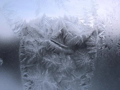 Frosty pattern on winter window Stock Photos