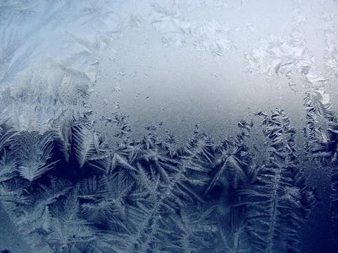 Frosty pattern on winter window Stock Photos